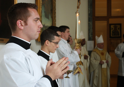 College Masters of Ceremony John LoCoco ('18) and Louis Masi ('18) prepare for Thanksgiving Mass.
