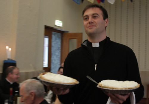Rev. Bill Slattery ('15) serves up a pumpkin pie.