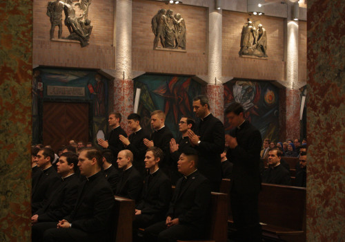 As their names are called, the men stand to present themselves to the service of the Word.