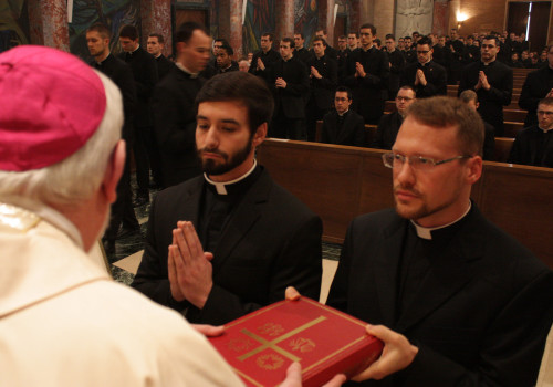 Michael Caraway and John Calabro are installed as lectors.