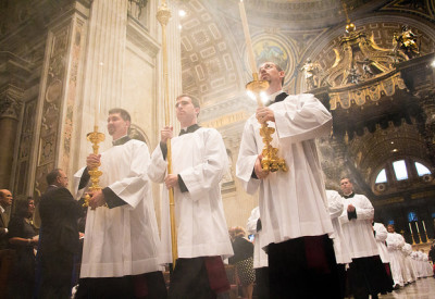 Acolytes Mark Mleziva (Green Bay, '17), Grayson Heenan (Detroit, '17), and Dennis Conway (Dubuque, '17), lead the entrance procession to the Altar of the Chair in St. Peter's Basilica.